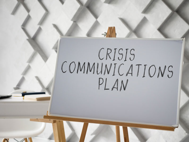 Crisis Responses for Partnerships - White board with the words "Crisis Communications Plan" written on it.